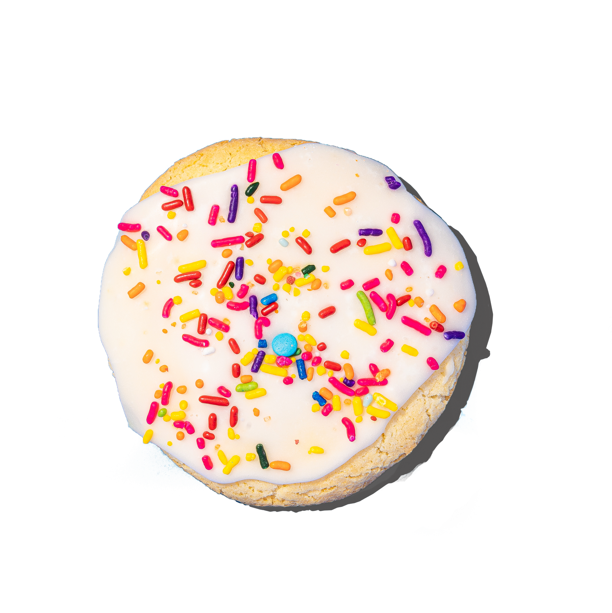 Cookie with white icing and colorful sprinkles on a white background