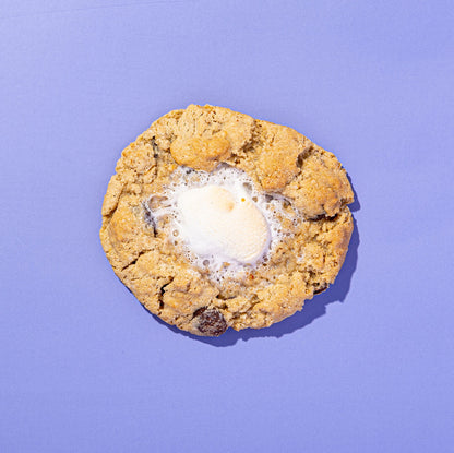 Cookie with a melted marshmallow on a purple background