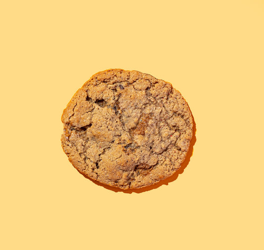 Brown cookie on a yellow background
